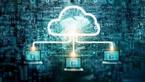 A glowing cloud icon connects to three laptops with padlocks, symbolizing secure cloud computing, data protection, and managed IT services in Contra Costa County, CA against a digital background of circuitry and code.
