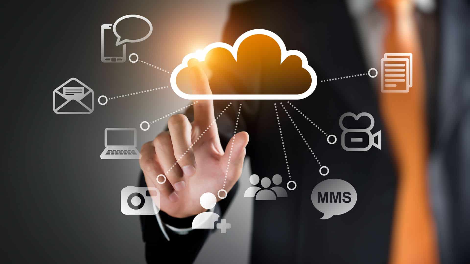 A person in a business suit touches a glowing cloud icon, surrounded by connected icons, symbolizing managed IT Services Contra Costa County and digital connectivity powered by advanced cloud computing and cybersecurity Contra Costa County.