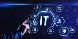 A hand points at a glowing "IT" text on a digital screen surrounded by hexagonal icons representing technology concepts like cybersecurity Contra Costa County, cloud computing, networking, data, and managed IT Services Contra Costa County.